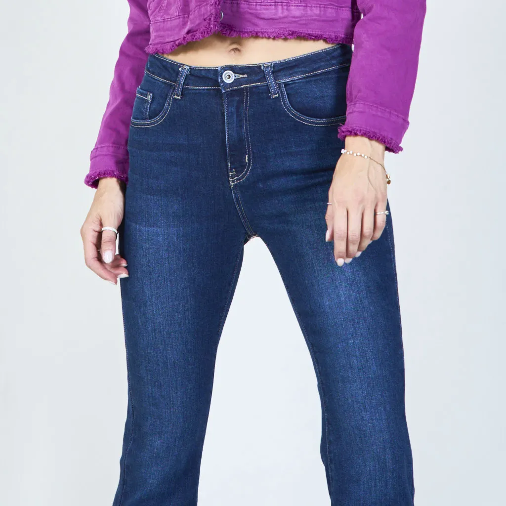 Trendy high-waisted flare jeans with frayed hem wholesale