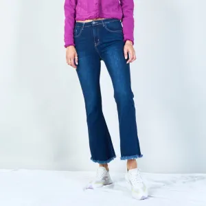 Trendy high-waisted flare jeans with frayed hem wholesale