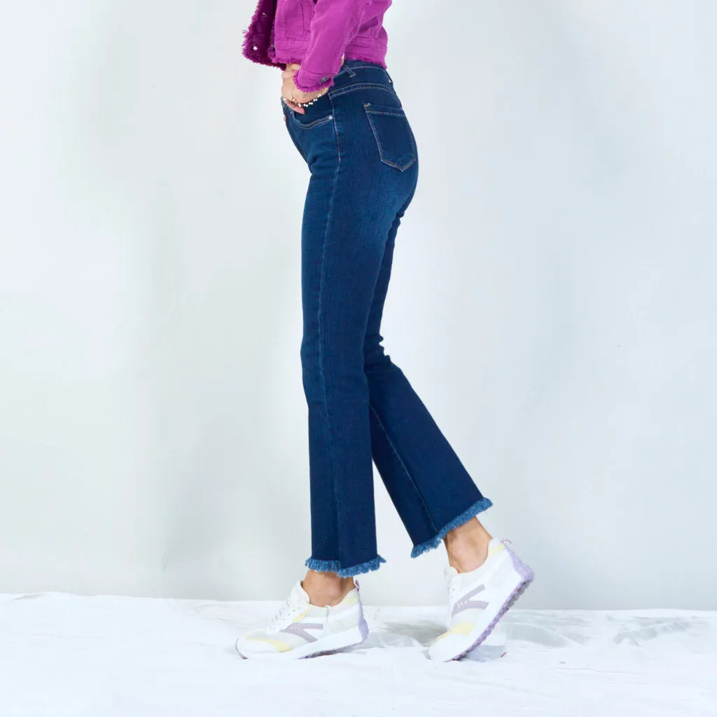 Trendy high-waisted flare jeans with frayed hem wholesale