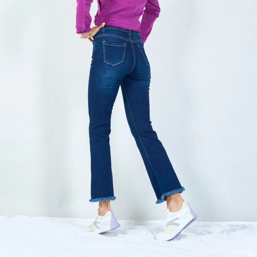 Trendy high-waisted flare jeans with frayed hem wholesale